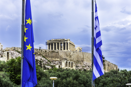 European Union and Greek flag in front of the Acropolis of Athens, Greeceの写真素材