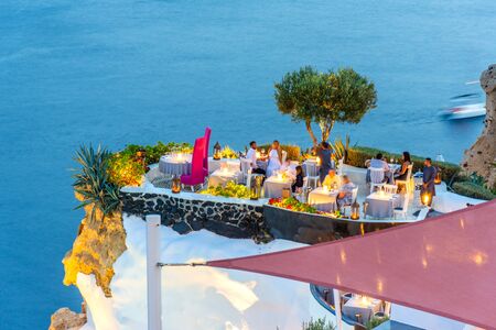 Santorini, Greece. Picturesque view of traditional cycladic Santorini restaurant on cliffのeditorial素材