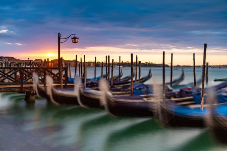 Gondolas moored in Piazza San Marco with San Giorgio Maggiore church in the backgroundの写真素材