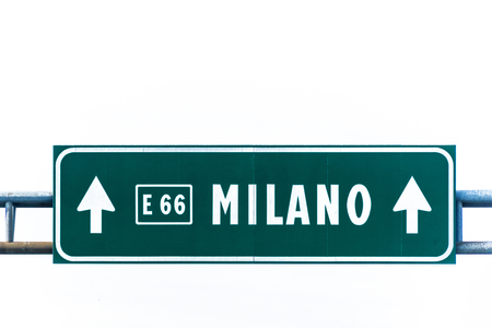 Green highway to Milano sign isolated on white.の写真素材