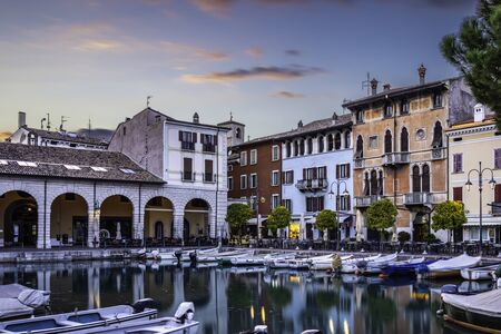 Sunset over marina at Lake Garda in Desenzano, Italyの写真素材