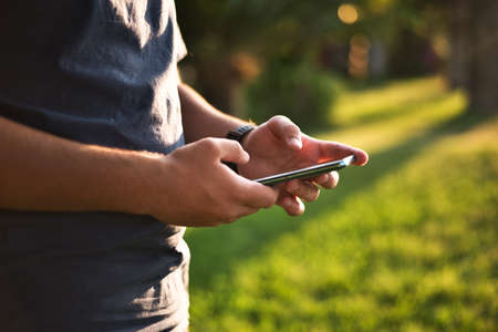 Teenage Boy Using Phone In Urban Settingの写真素材