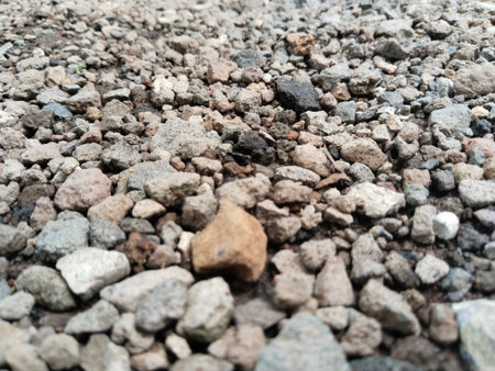 Gravel on the ground for background or texture. Selective focus.