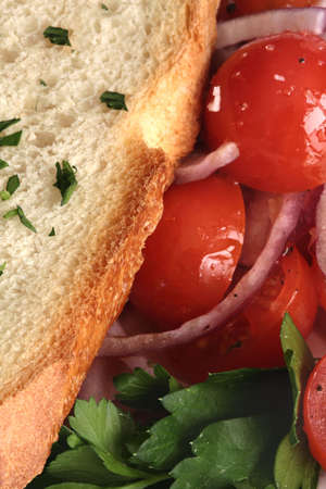 Close Up of Tomato and Onion Salad with Breadの写真素材