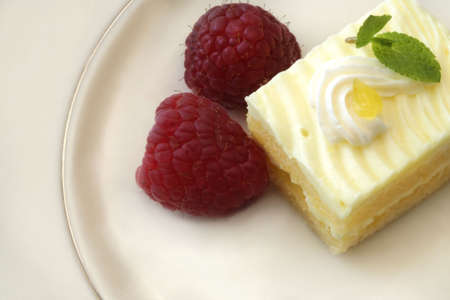 Lemon Cake with Raspberries and Mint Leaves
