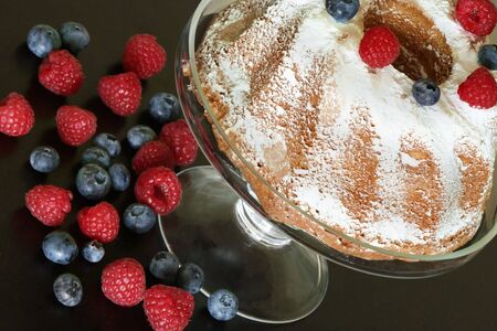 Coffee cake with raspberries and blueberriesの写真素材