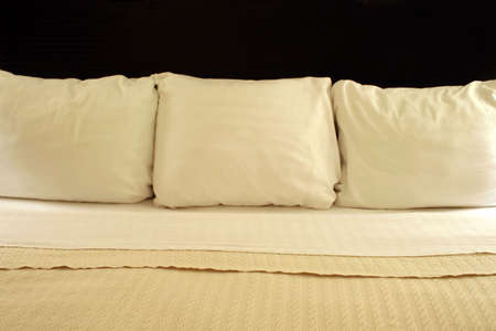 Three Pillows on Bed