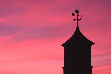 Weather Vane Against Sunset Skyの写真素材