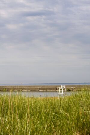 Lifeguard Chair on a Grassy Beachの写真素材