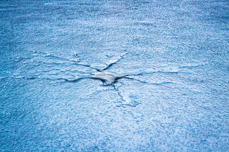 Frozen crack in the ice of a lake in Berlinの写真素材