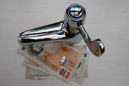 A tap with English currency notes.