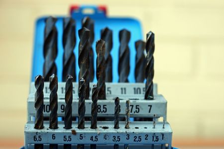 set of large and small drill bits in a box.の写真素材