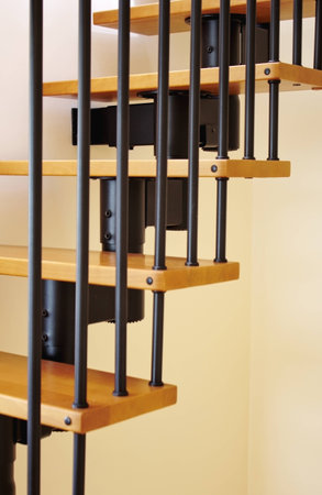Tall, wooden stairs with steel construction shot in bright scenery の写真素材