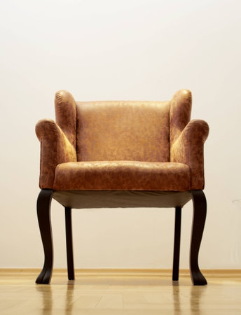 Beautiful, brown leather armchair shot from the floor with bright lighting の写真素材
