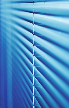 Blinds shot with a shallow depth of field in dark scenery の写真素材