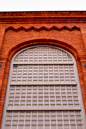Esthetic, antique window in the brick, tall, old building 