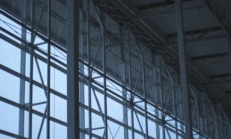 Glass wall of a tall, modern building in the city center shot indoor の写真素材
