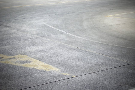Dirty car traces on the road/parking corner.の写真素材
