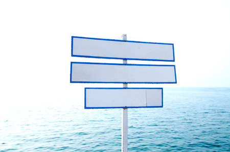 Blue sign nearly the sea signの写真素材