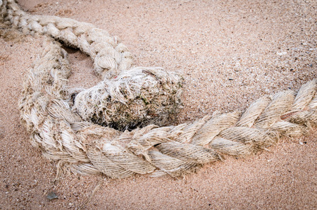 Mooring rope on sand ,rope for boatの写真素材