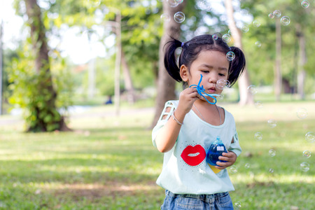 Asian baby girl playing bubble balloonの写真素材