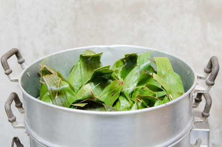 Thai steaming pot of banana leaf cover bakeの写真素材