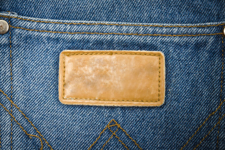 Close up tag on jeans background texture, blue jeansの写真素材
