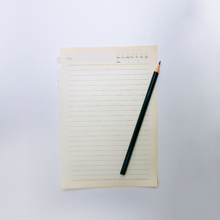 Pencil and notepaper on white backgroundの写真素材