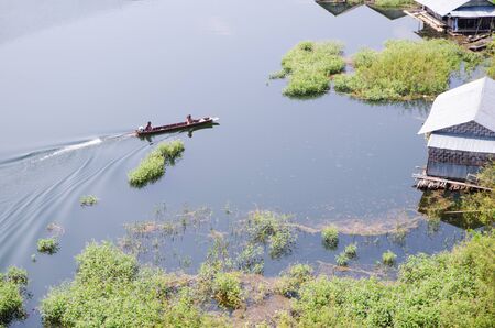 Floating house and boat in Karnjanaburi