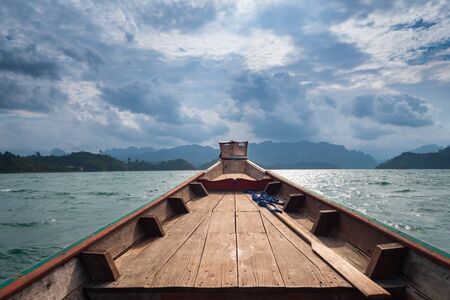 Scenic landscape of boat view in the big river and reservoir dam with mountain and nature forestの写真素材