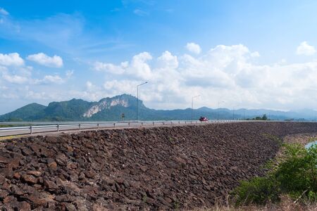 Scenic landscape of big river and reservoir dam with mountain and nature forestの写真素材