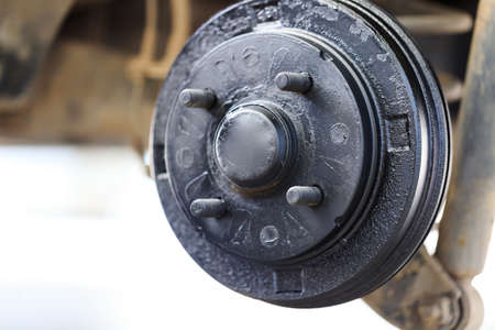 A rear hub of the car after removing a tire and wheel, maintaining a brake and wheel system, car jack-up for change a car wheel, Close-up shotの写真素材