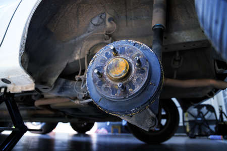 A rear hub of the car after removing a tire and wheel, maintaining a brake and wheel system, car jack-up for change a car wheel, Close-up shotの写真素材