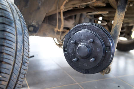 A rear hub of the car after removing a tire and wheel, maintaining a brake and wheel system, car jack-up for change a car wheel, Close-up shotの写真素材