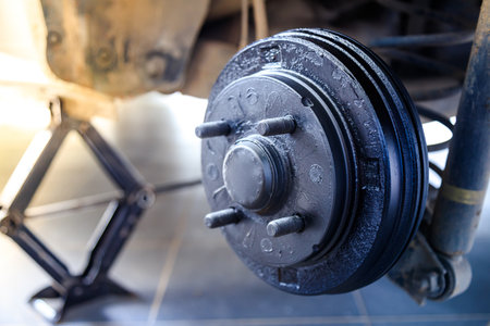 A rear hub of the car after removing a tire and wheel, maintaining a brake and wheel system, car jack-up for change a car wheel, Close-up shotの写真素材