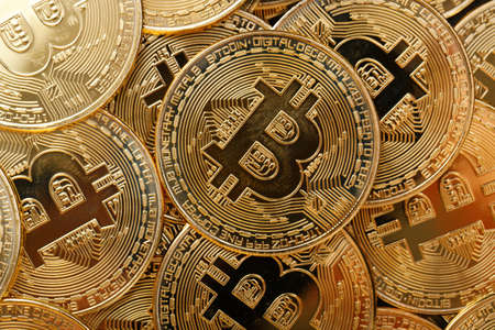 Close up shot of Bitcoin coins on black background,  A pile of Bitcoin Cryptocurrency Gold Bitcoin BTC Bit Coin.  Digital blockchain technology, bitcoin mining conceptの写真素材