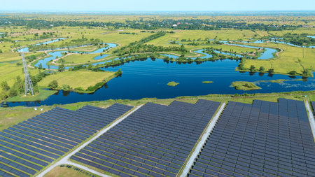 Drone shot aerial view solar energy array provides renewable power in large scale facility...