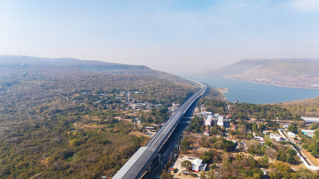 Drone shot The M6  motorway Expressway Nakhon Ratchasima Province - Bang Pa-in. Lam Ta Khong River and Mountain. Drone shot of scenic landscape rural place traffic. Nakhon Ratchasima Thailand. Motorway Koratの写真素材