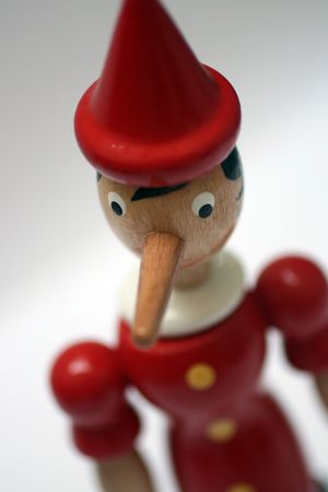 wooden statue of pinnochio representing a gentle liarの写真素材