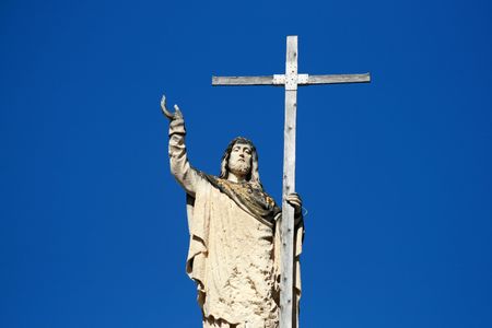 a statue of Jesus and his Crossの写真素材