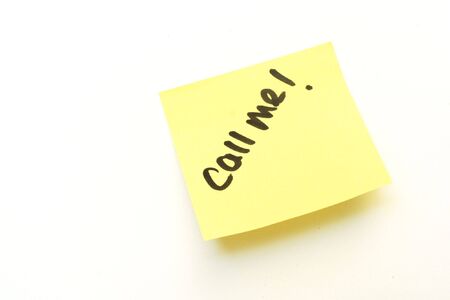 call me on a yellow sticky adhesive noteの写真素材