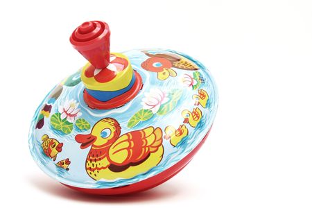 colourful vintage spinning top isolated on whiteの写真素材