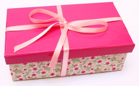 pink present with a flower base box with a pink ribbonの写真素材
