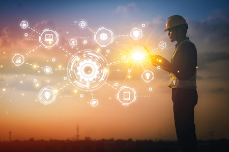 Engineer using tablet to inspect work at job site. concept of technology usage In industrial applications, remote data retrieval, large databases. network link.の写真素材