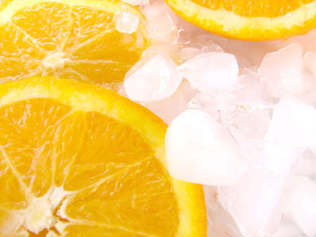 Shot of an orange cut it in slices over ice.の写真素材
