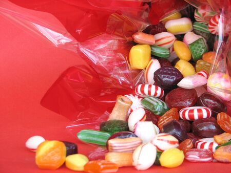 Shot of assortment hard candies in different flavors and colors.の写真素材