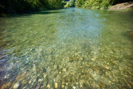 Lake with blue mountains and sky in europeの写真素材