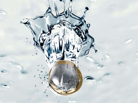 euro coin is falling into a Wishing Wellの写真素材