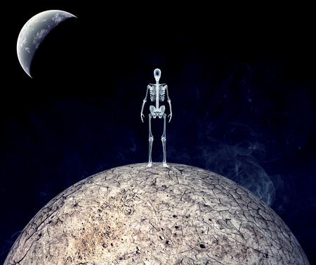 dry earth with skeleton isolated on black back groundの写真素材