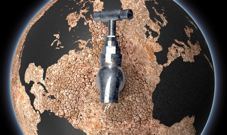 global drought concept, dry planet earth with  a water tapの写真素材